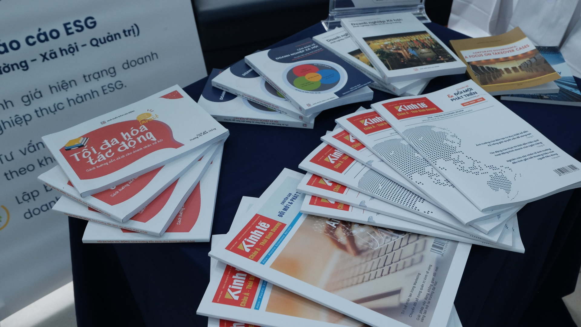 IID research publications and ESG reports laid out on a table during a working session.